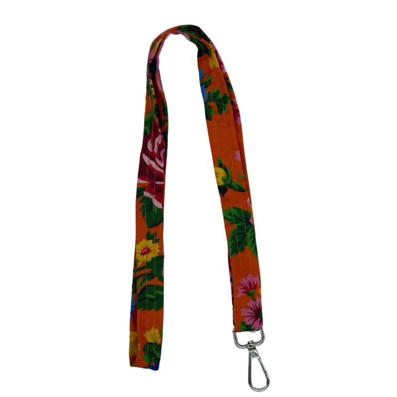 A multicolored floral-patterned lanyard with an orange background and a clip at the end.
