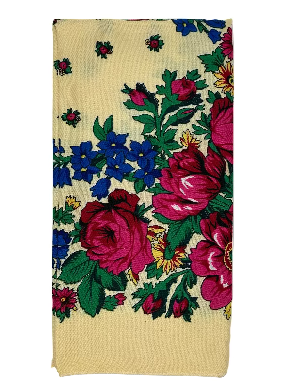 Floral patterned fabric with pink and blue flowers on a beige background