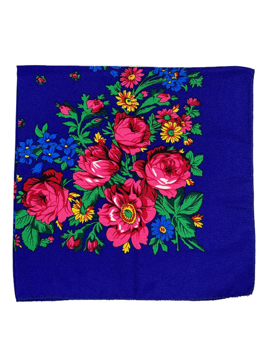 Floral patterned fabric with pink flowers on a blue background