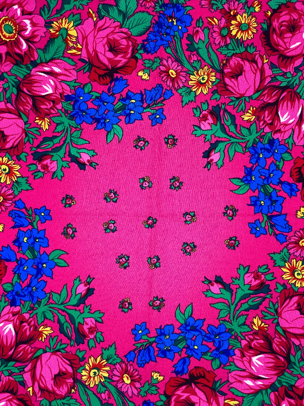 Floral patterned fabric on a pink background
