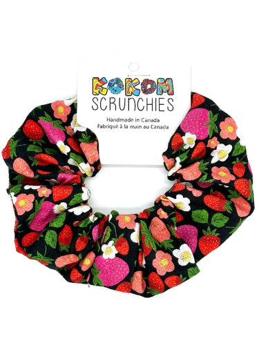 Scrunchie with strawberry pattern on a white background, featuring 'Kokom Scrunchies' branding.