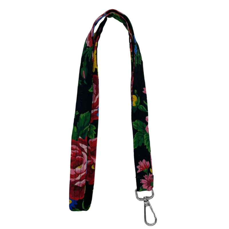 A black lanyard with a floral pattern, including shades of pink, red, and green, and a metal clip.