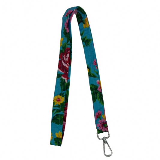 A light blue lanyard with a floral pattern, including images of a pink flower and green leaves, and a metal clip.