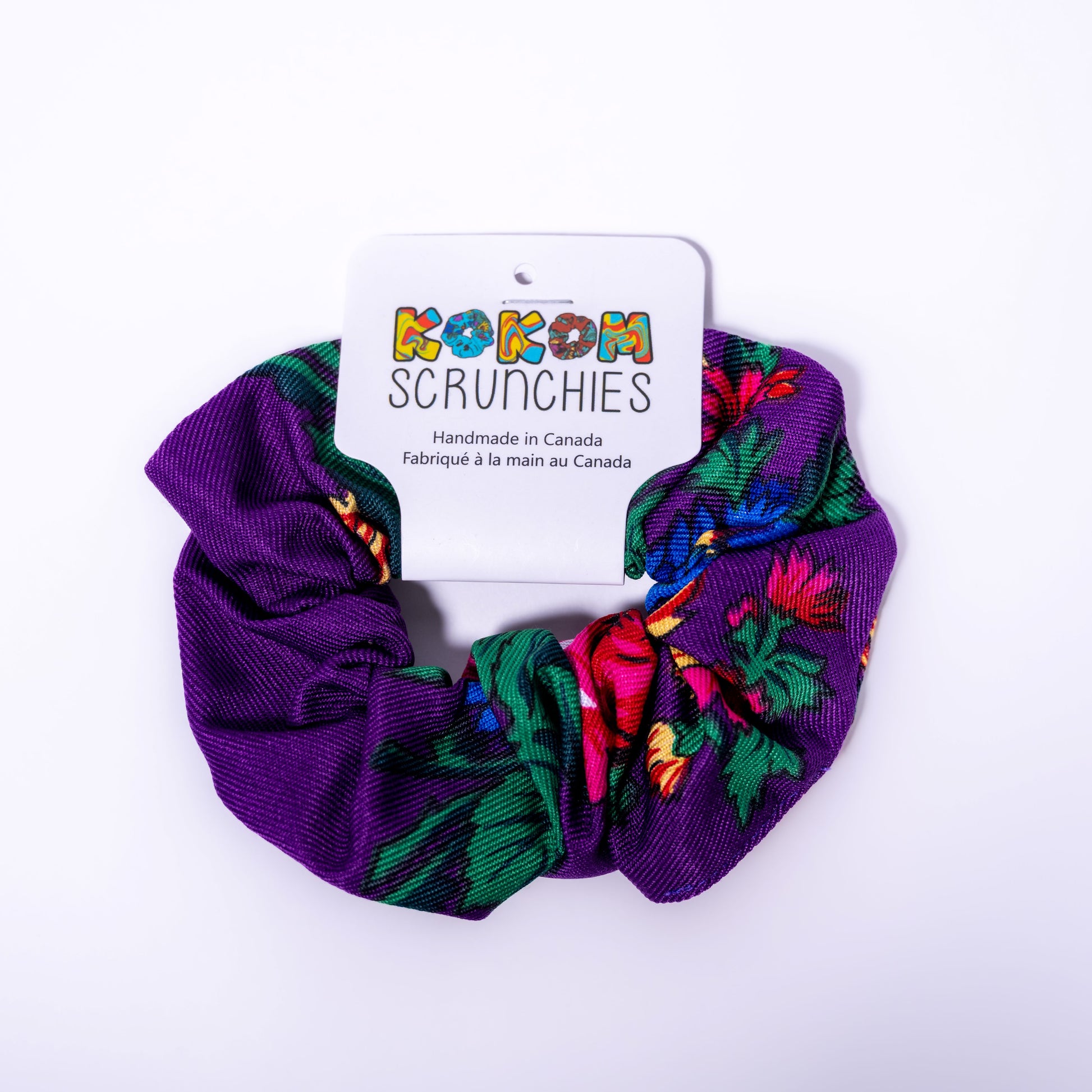 colorful scrunchie with a 'Kokom Scrunchies' label on a white background