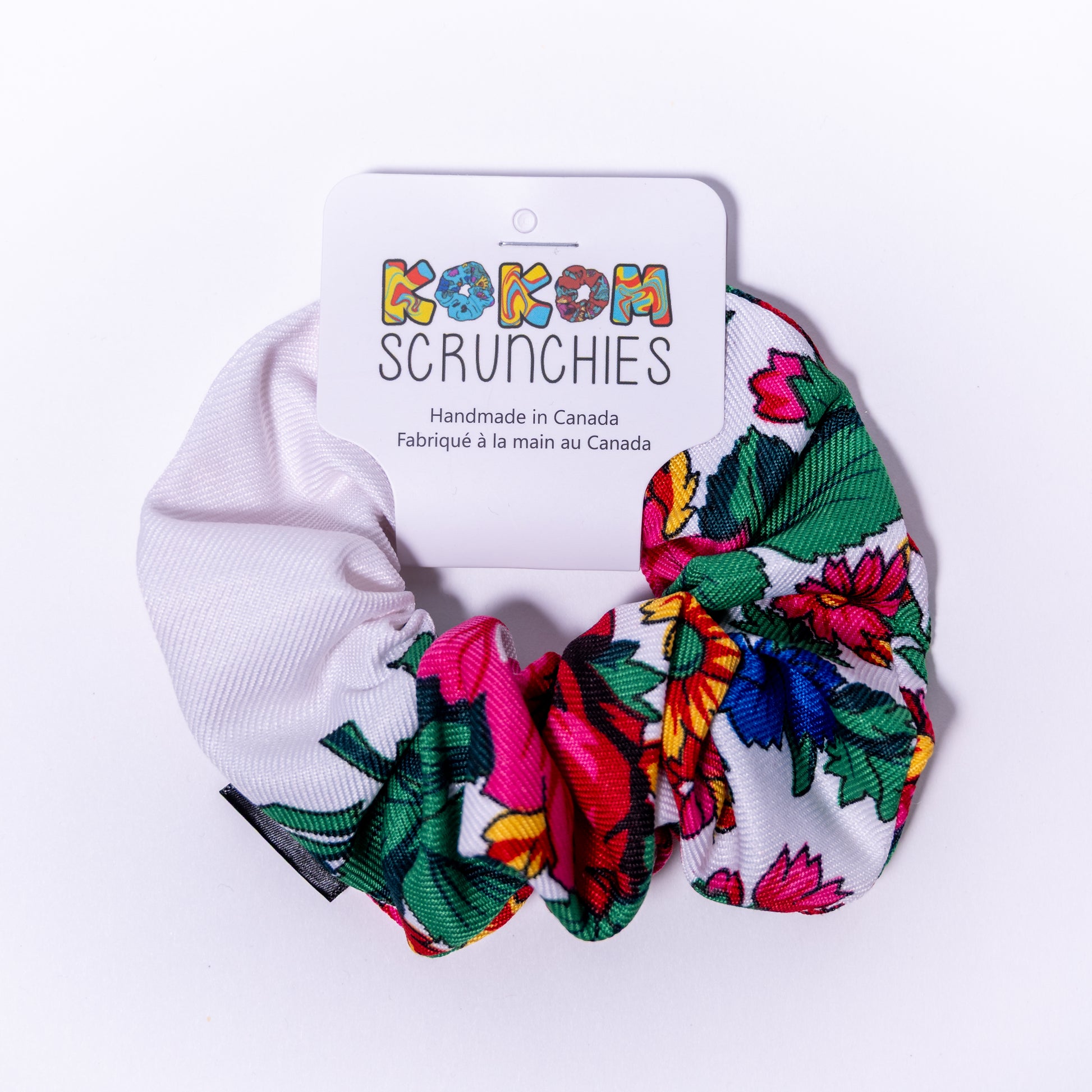 Floral scrunchies with a 'Kokom Scrunchies' branded card on a white background
