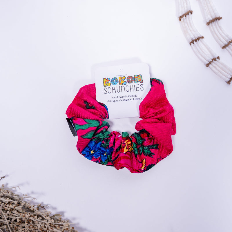 Colorful scrunchie with a brand label on a white background