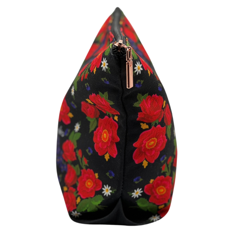 floral pattern with black background makeup bag turned sideways on a white background