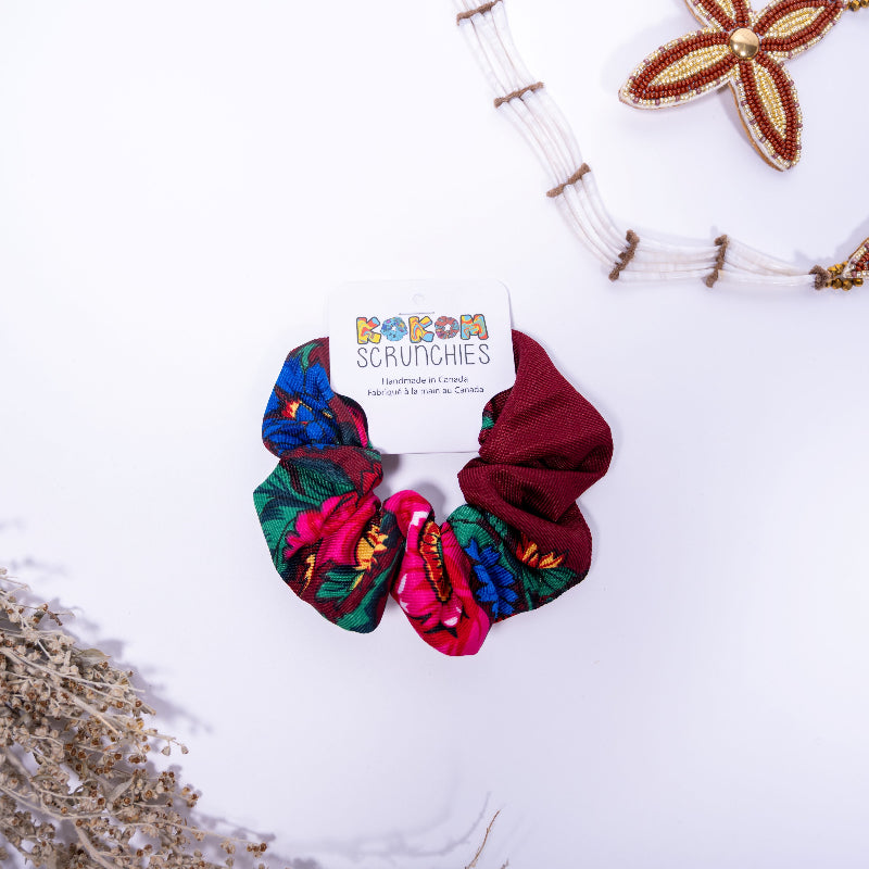Colorful scrunchies with a brand card on a white background