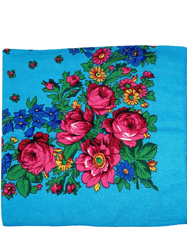 Floral patterned fabric with pink flowers on a light blue background