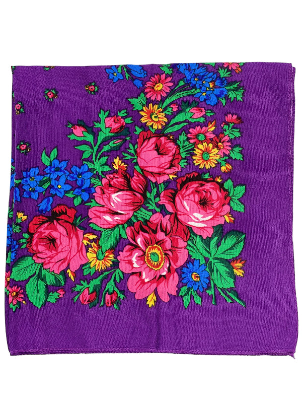Purple fabric with colorful floral pattern on a purple background